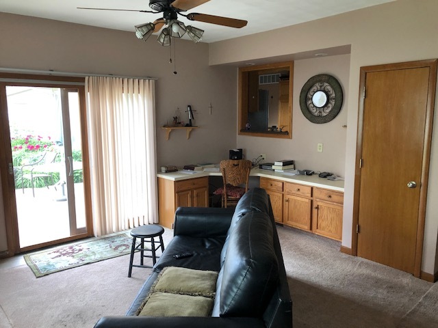 1065 North 3rd Street Rochelle, IL 61068 - Photo 9 of 17 a living room with furniture and a large window