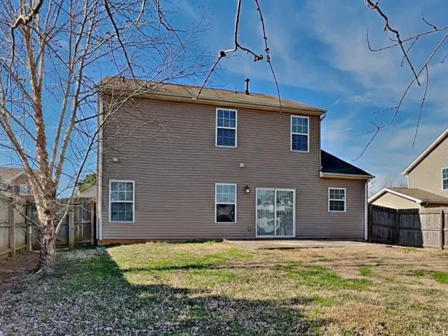 a house view with a backyard space