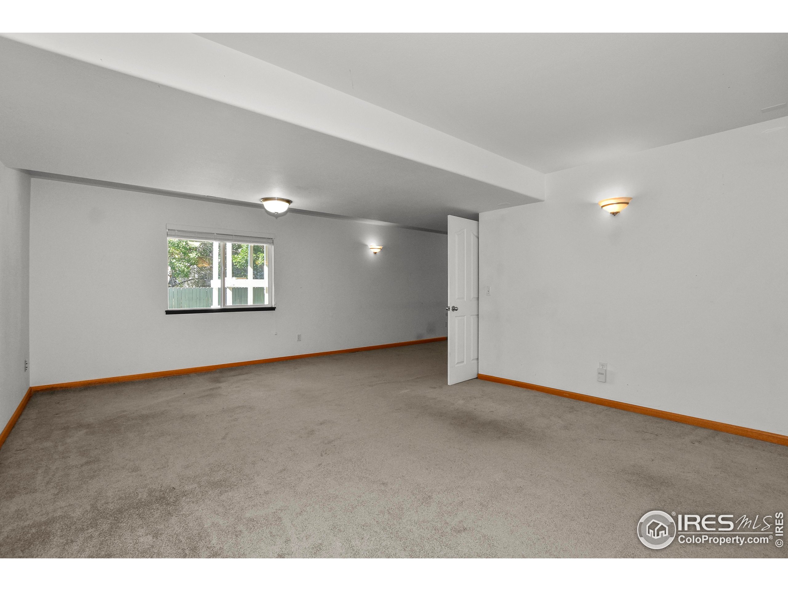 205 Timber Ridge Court Severance, CO 80550 - Photo 26 of 48 a view of an empty room with a window