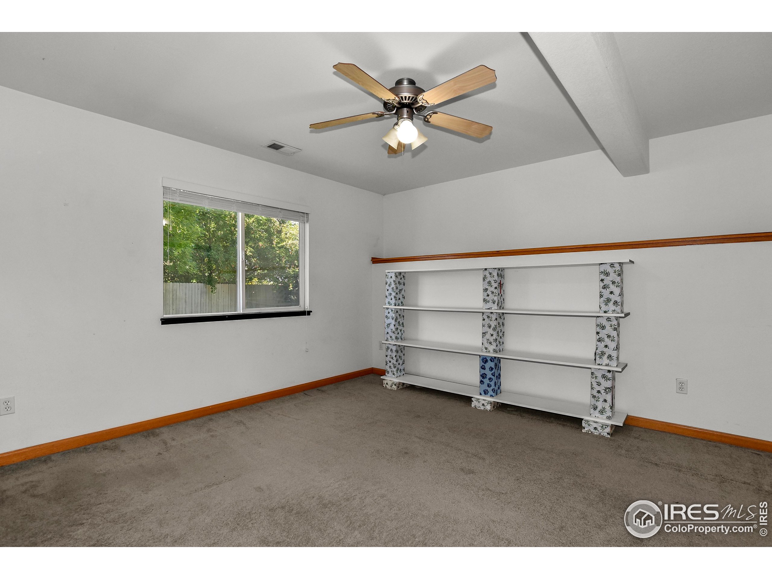 205 Timber Ridge Court Severance, CO 80550 - Photo 33 of 48 a view of an empty room with a window