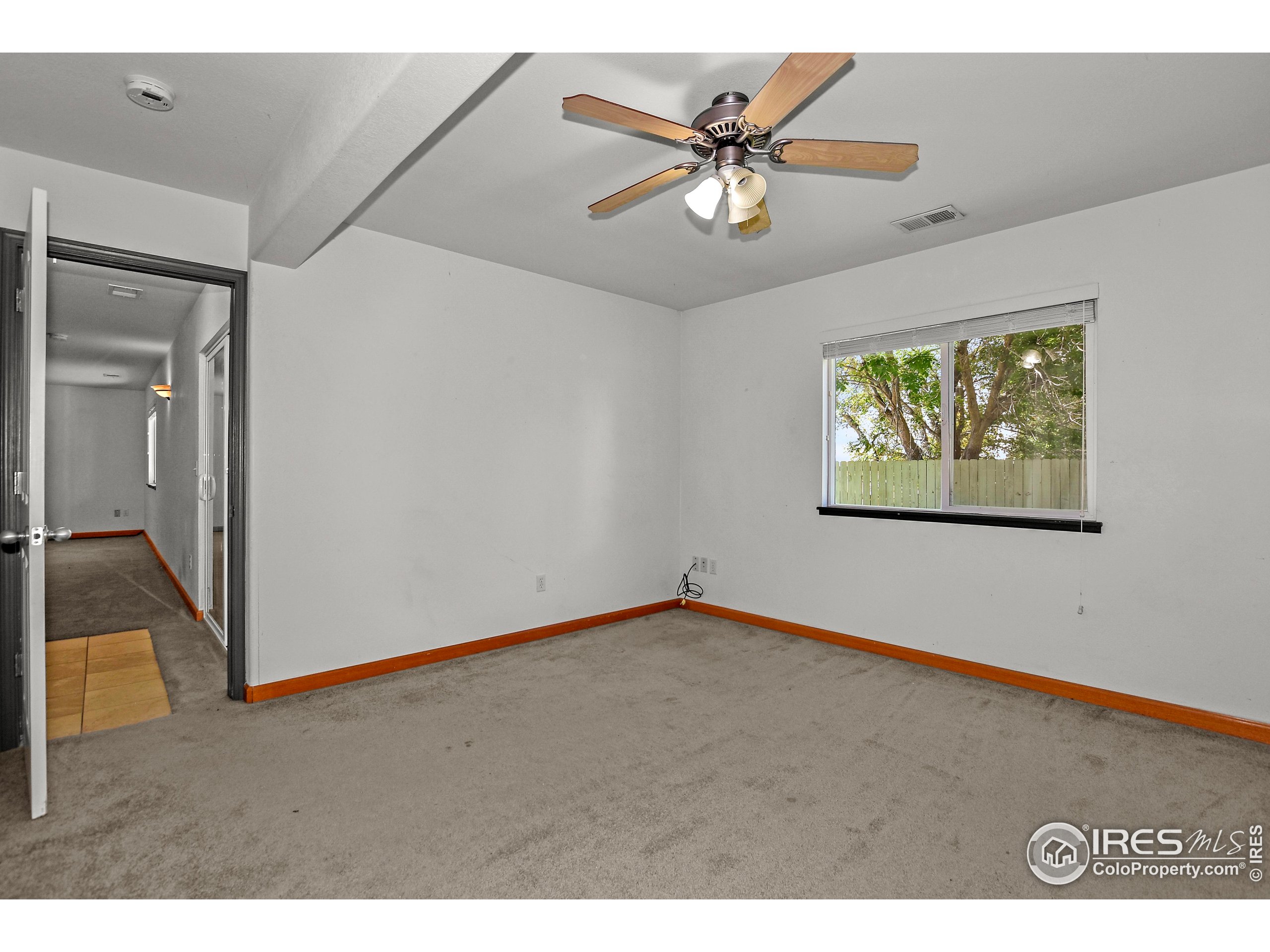 205 Timber Ridge Court Severance, CO 80550 - Photo 37 of 48 a view of an empty room and wooden floor