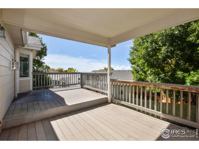 a view of balcony with wooden floor