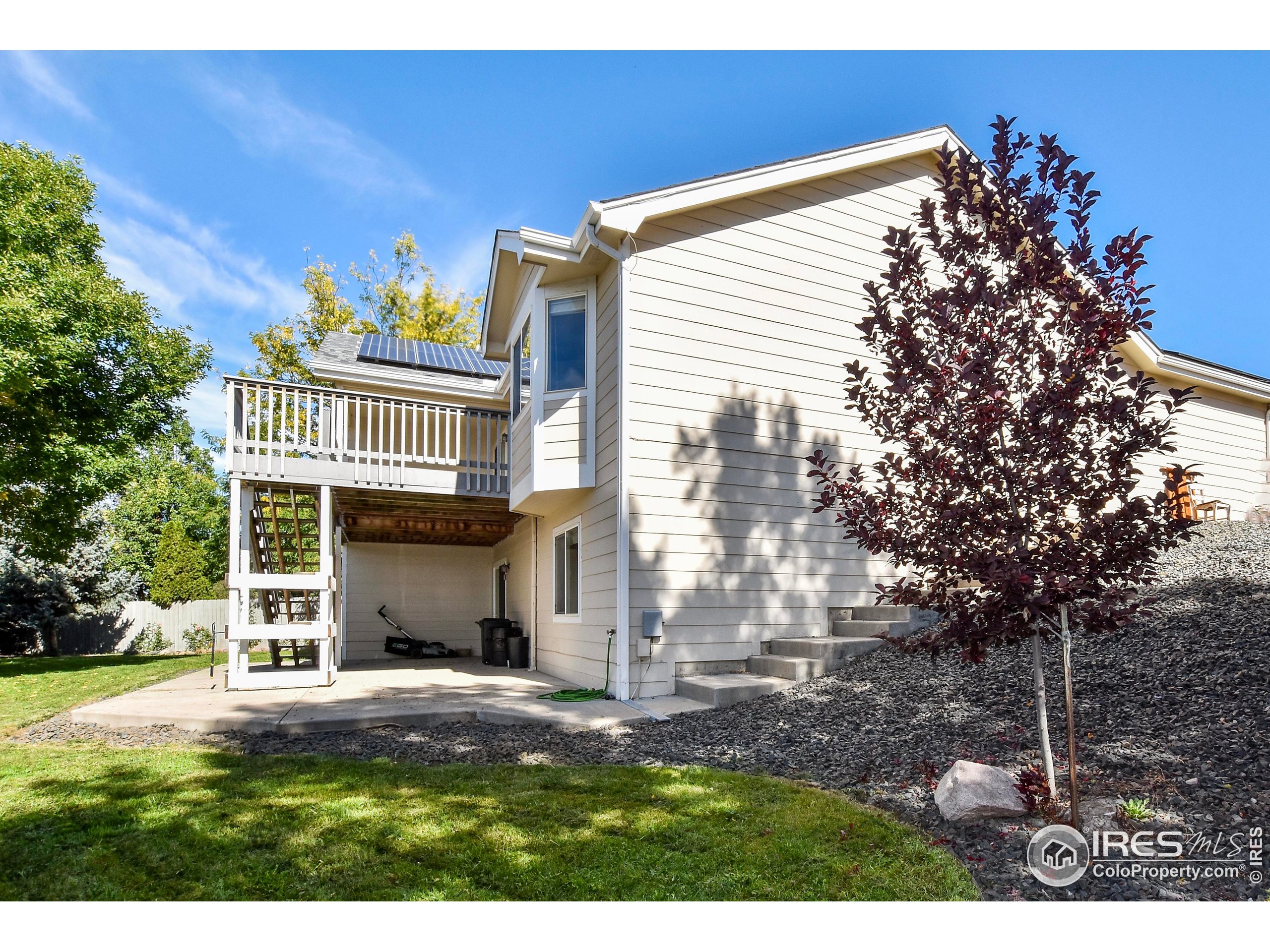 205 Timber Ridge Court Severance, CO 80550 - Photo 46 of 48 a view of a house with a yard