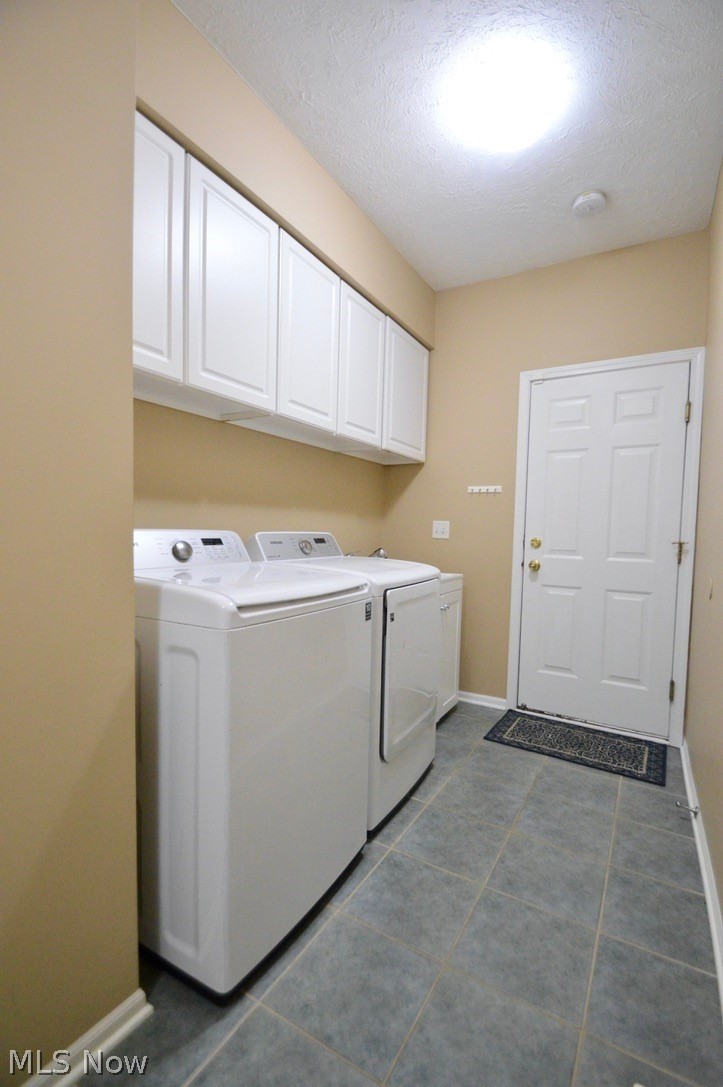 30247 Center Ridge Road, Unit 12 Westlake, OH 44145 - Photo 20 of 35 First floor laundry room with storage cabinets and door to attached 2 car garage