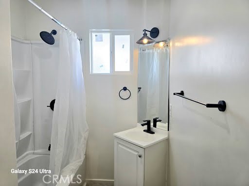 1350 East 94th Street Los Angeles, CA 90002 - Photo 12 of 15 a bathroom with a shower sink and mirror