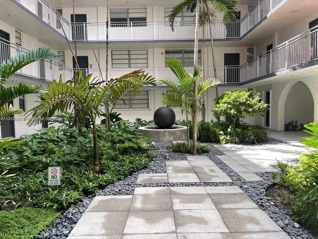 a view of a garden with pathway