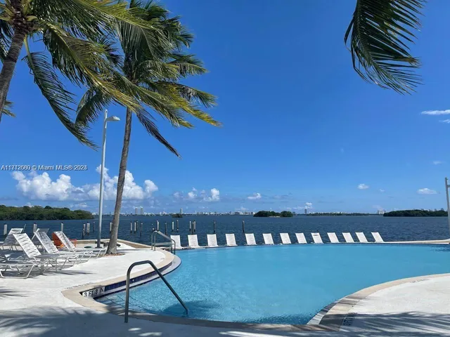a view of a balcony with chair and table