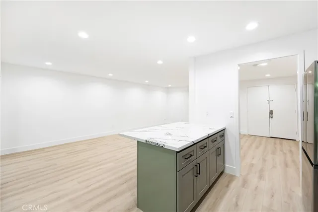 an empty room with wooden floor