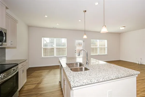 a kitchen with a sink and cabinets