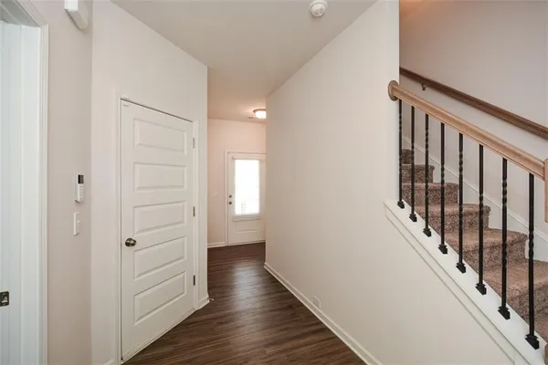 a view of entryway with wooden floor