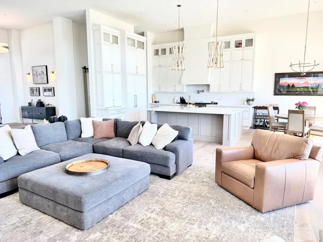 a bathroom with a tub a sink a mirror and a shower