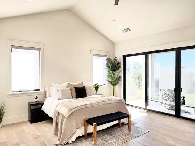 a bathroom with a sink a mirror and a shower