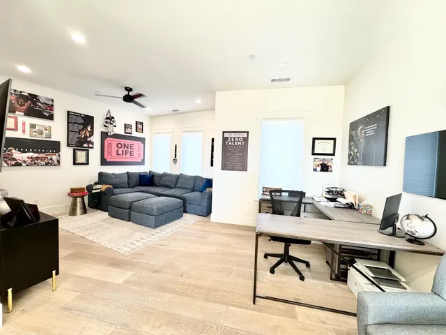 a view of living room kitchen and dining room