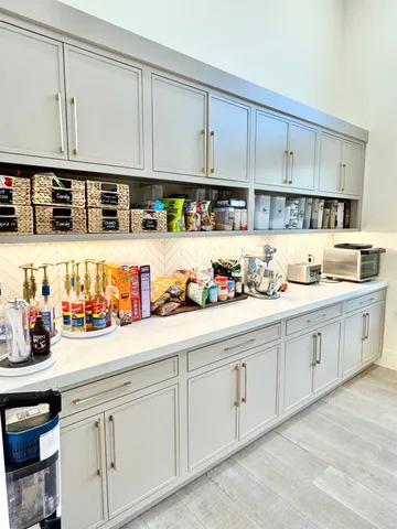 a bedroom with a large bed and a large window