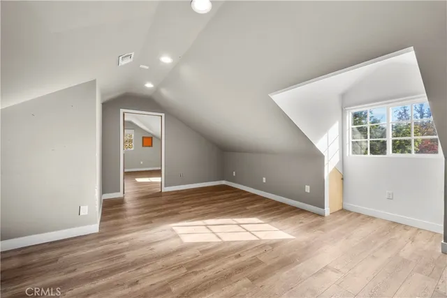 an empty room with windows and entrance