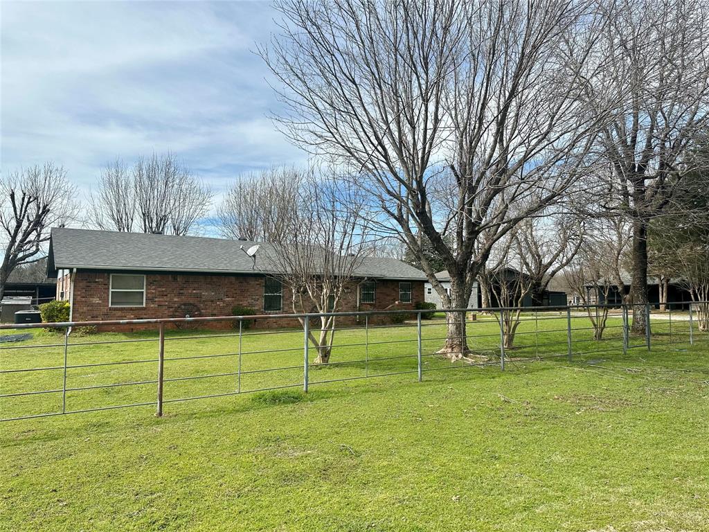 a view of a park with large trees