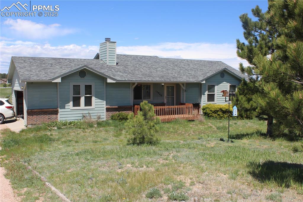 15840 Teak Place Elbert, CO 80106 - Photo 1 of 32 a front view of a house with a garden