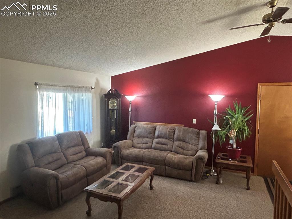 15840 Teak Place Elbert, CO 80106 - Photo 13 of 32 a living room with furniture and a lamp