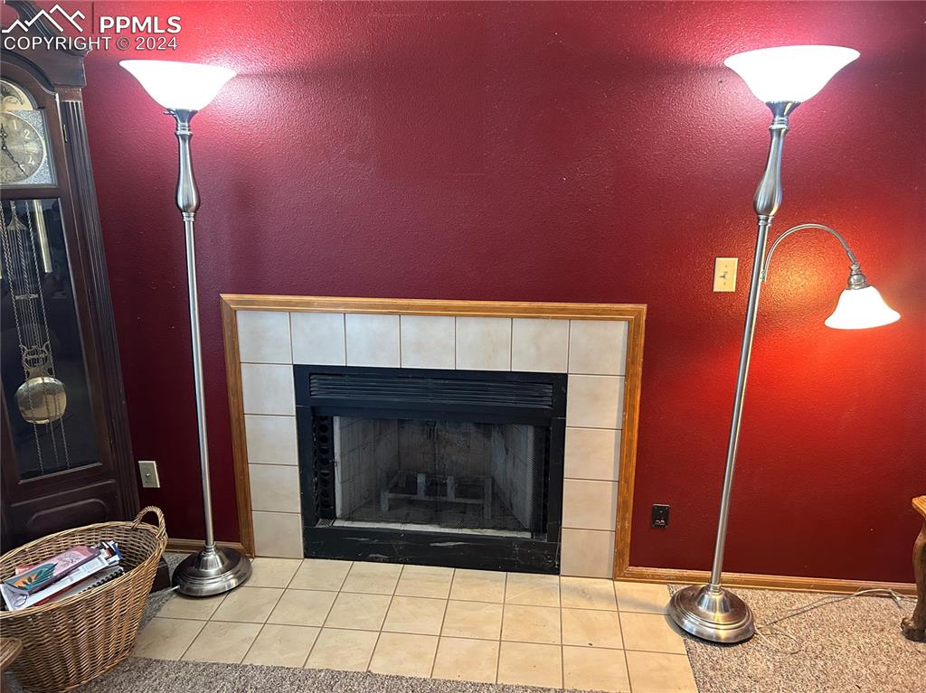 15840 Teak Place Elbert, CO 80106 - Photo 14 of 32 a room with fireplace and window