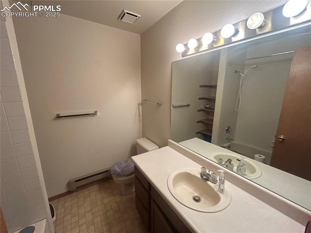 15840 Teak Place Elbert, CO 80106 - Photo 27 of 32 a bathroom with a sink and a mirror