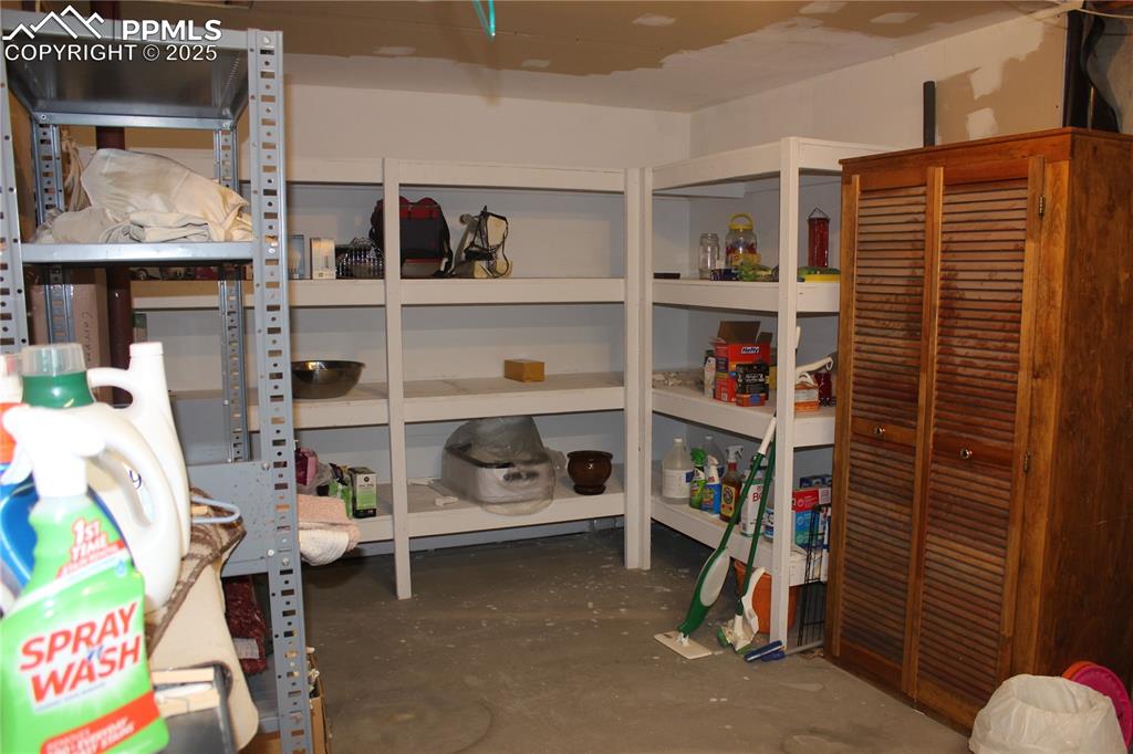 15840 Teak Place Elbert, CO 80106 - Photo 30 of 32 a room with storage and a white door
