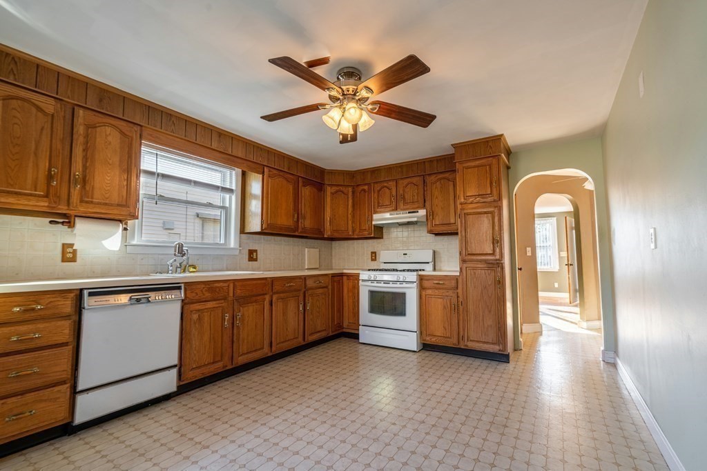 95 Rome Avenue Providence, RI 02908 - Photo 7 of 15 a kitchen with stainless steel appliances sink and cabinets