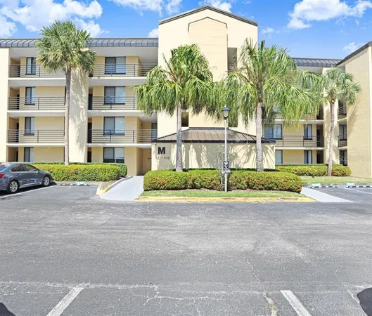 a view of a multi story building with a yard