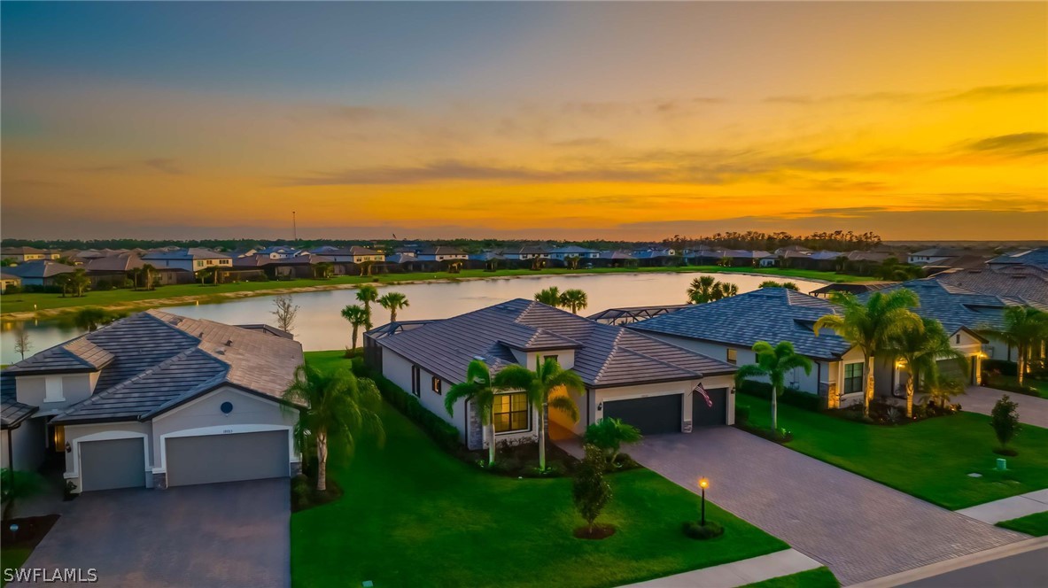 19729 Beechcrest Place Estero, FL 33928 - Photo 2 of 45 a view of a lake with a garden