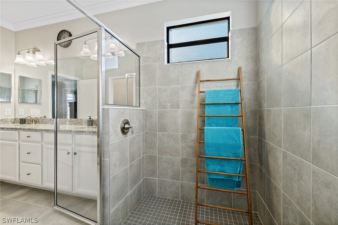 19729 Beechcrest Place Estero, FL 33928 - Photo 21 of 45 a bathroom with a shower
