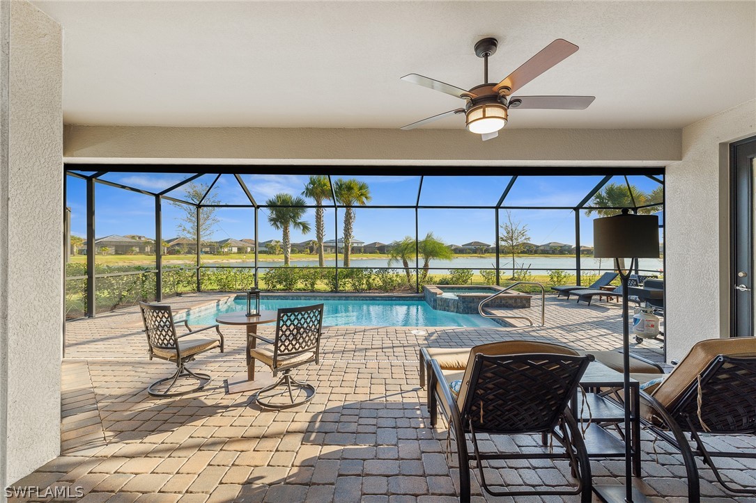 19729 Beechcrest Place Estero, FL 33928 - Photo 26 of 45 a dining room with furniture and chandelier