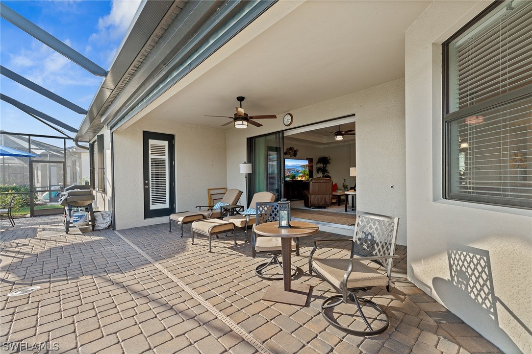 19729 Beechcrest Place Estero, FL 33928 - Photo 27 of 45 a view of a dinning room with table and chairs
