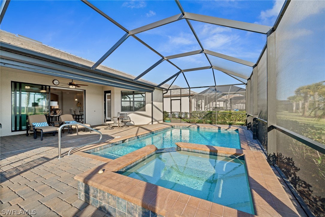 19729 Beechcrest Place Estero, FL 33928 - Photo 30 of 45 a view of swimming pool with outdoor seating