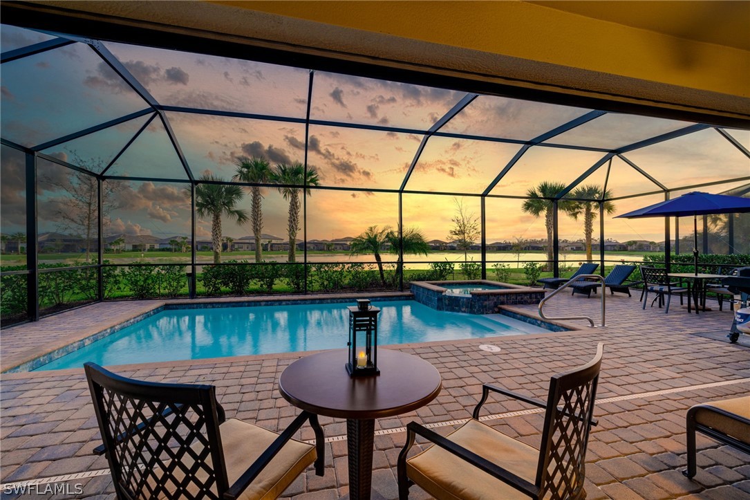 19729 Beechcrest Place Estero, FL 33928 - Photo 3 of 45 a patio with water view fountain and outdoor seating