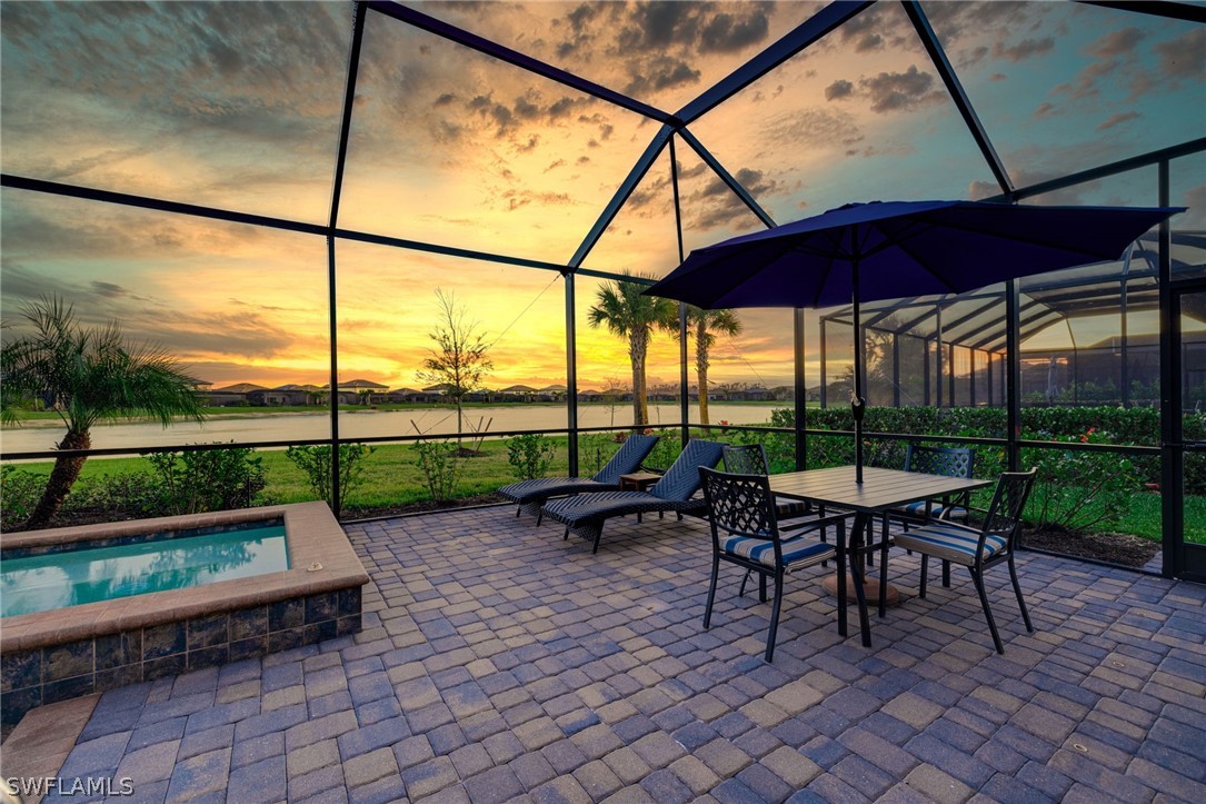 19729 Beechcrest Place Estero, FL 33928 - Photo 33 of 45 a view of bench sitting under a large umbrella