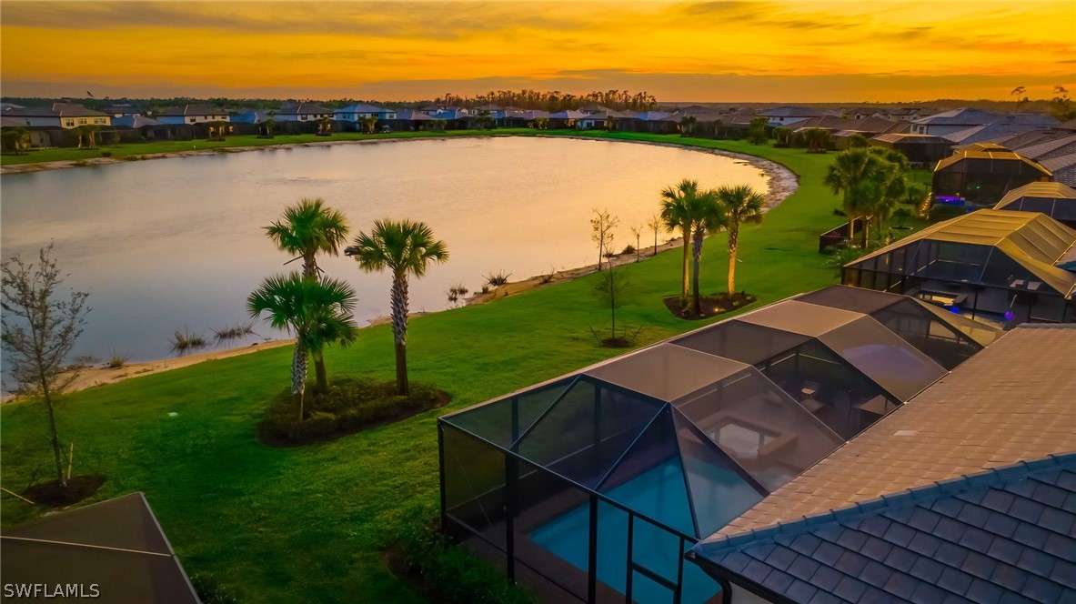19729 Beechcrest Place Estero, FL 33928 - Photo 34 of 45 a view of a lake with a mountain in the background