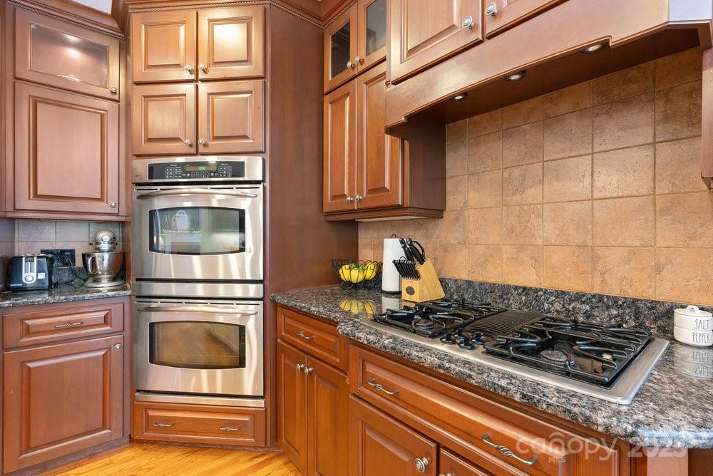 134 Brightmore Circle Rutherfordton, NC 28139 - Photo 12 of 40 a kitchen with granite countertop a stove and a refrigerator