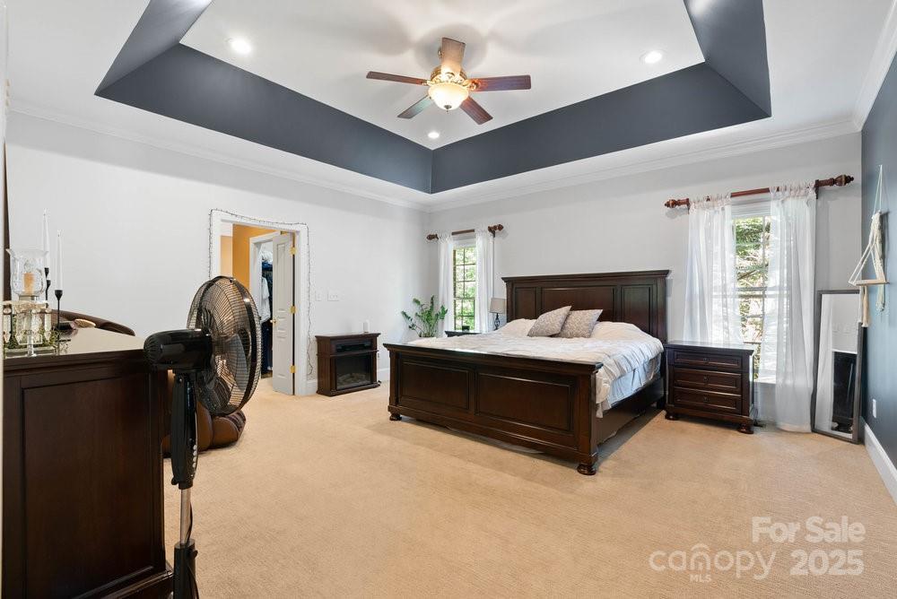 134 Brightmore Circle Rutherfordton, NC 28139 - Photo 14 of 40 a bed room with a bed and a chandelier