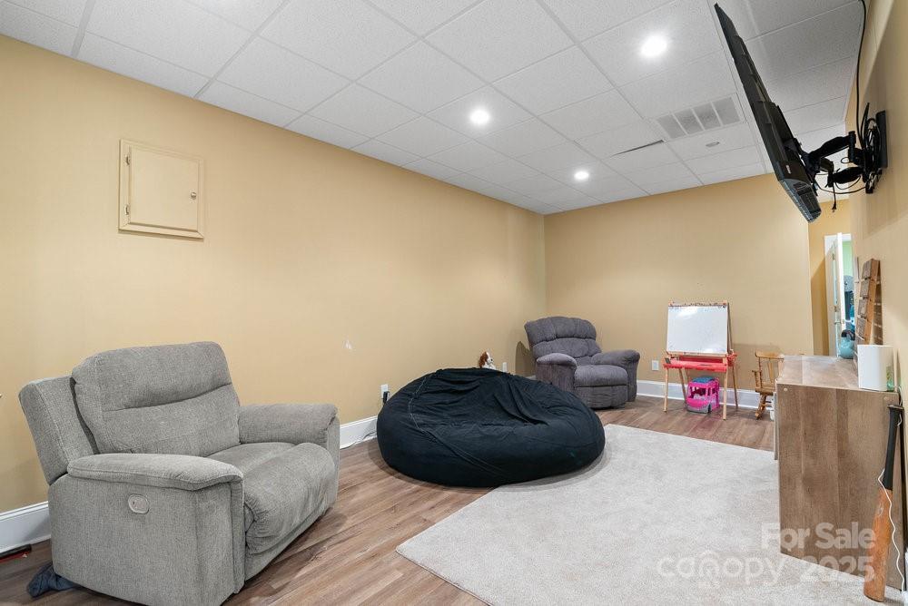 134 Brightmore Circle Rutherfordton, NC 28139 - Photo 22 of 40 a living room with furniture and a flat screen tv