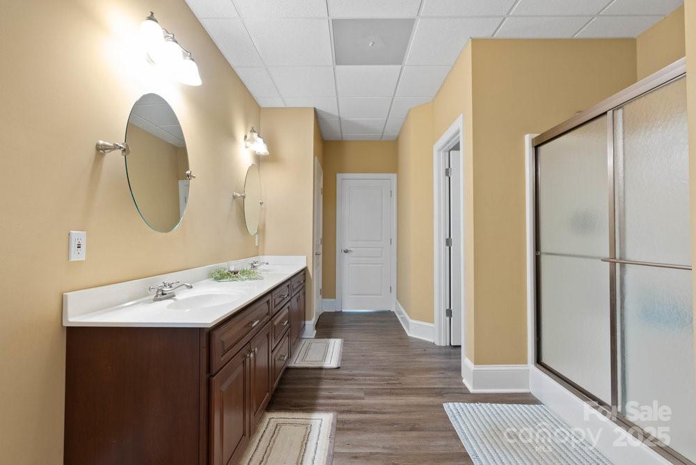 134 Brightmore Circle Rutherfordton, NC 28139 - Photo 27 of 40 a bathroom with a double vanity sink and a mirror