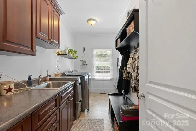 a kitchen with a sink stove and cabinets