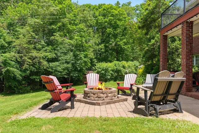 a backyard of a house with outdoor seating
