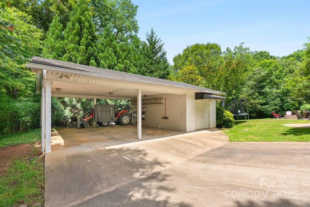 134 Brightmore Circle Rutherfordton, NC 28139 - Photo 39 of 40 a view of a house with a yard and potted plants
