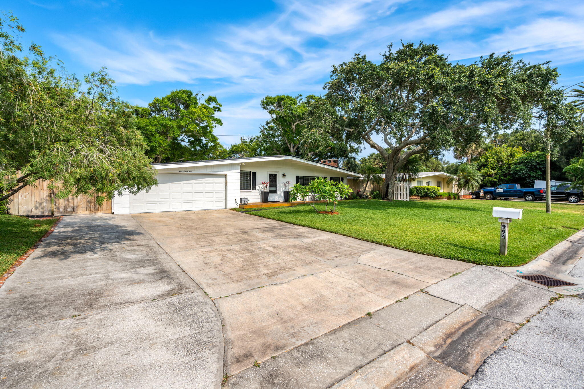 994 Samar Road Cocoa Beach, FL 32931 - Photo 3 of 34 front view of a house with a yard