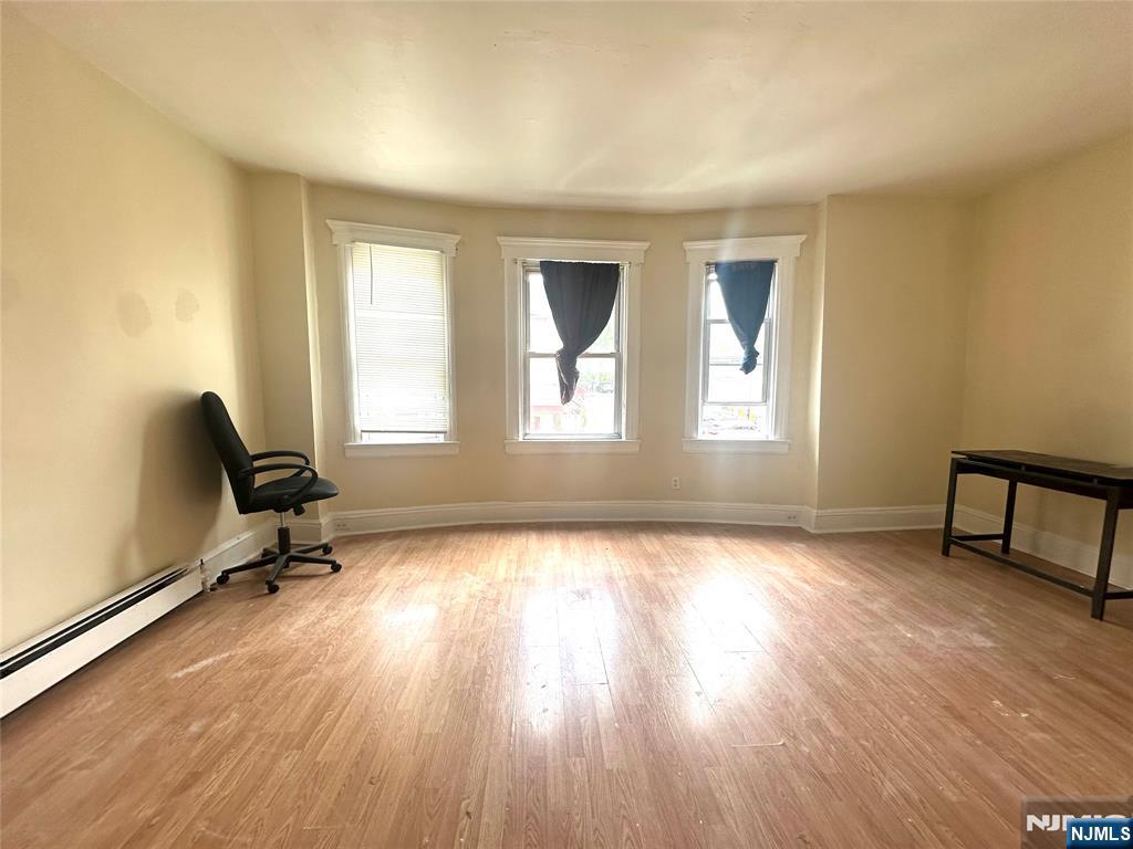 218 Main Street Ridgefield Park, NJ 07660 - Photo 6 of 8 a view of a workspace with furniture and a window