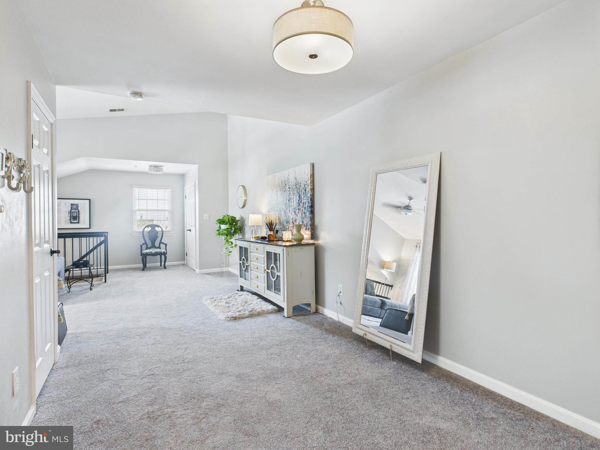 11269 Raging Brook Drive, Unit 258 Bowie, MD 20720 - Photo 16 of 36 a view of a livingroom with a furniture and a fireplace