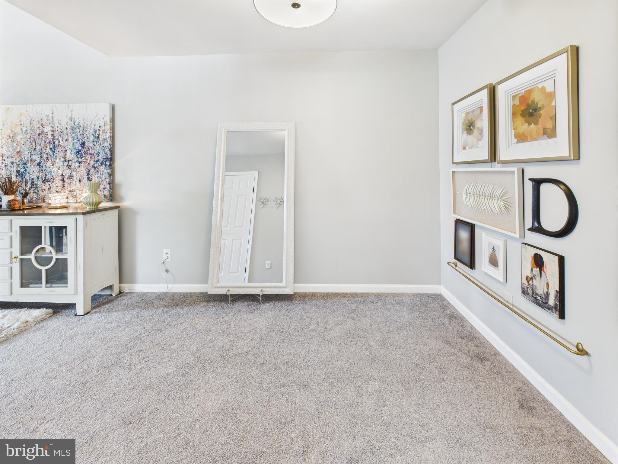 11269 Raging Brook Drive, Unit 258 Bowie, MD 20720 - Photo 17 of 36 a view of an entryway with wooden floor