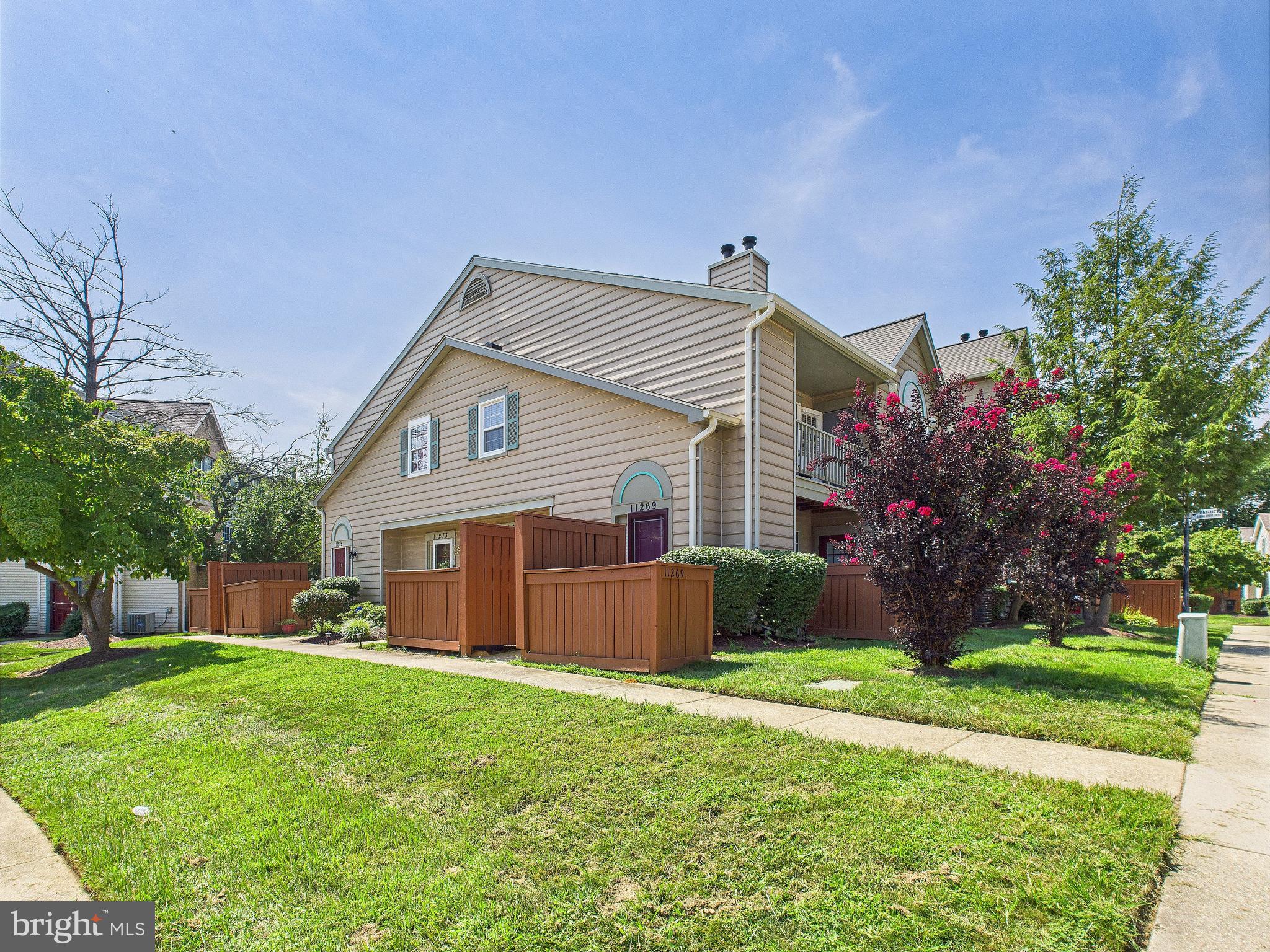 11269 Raging Brook Drive, Unit 258 Bowie, MD 20720 - Photo 2 of 36 a front view of house with yard and green space