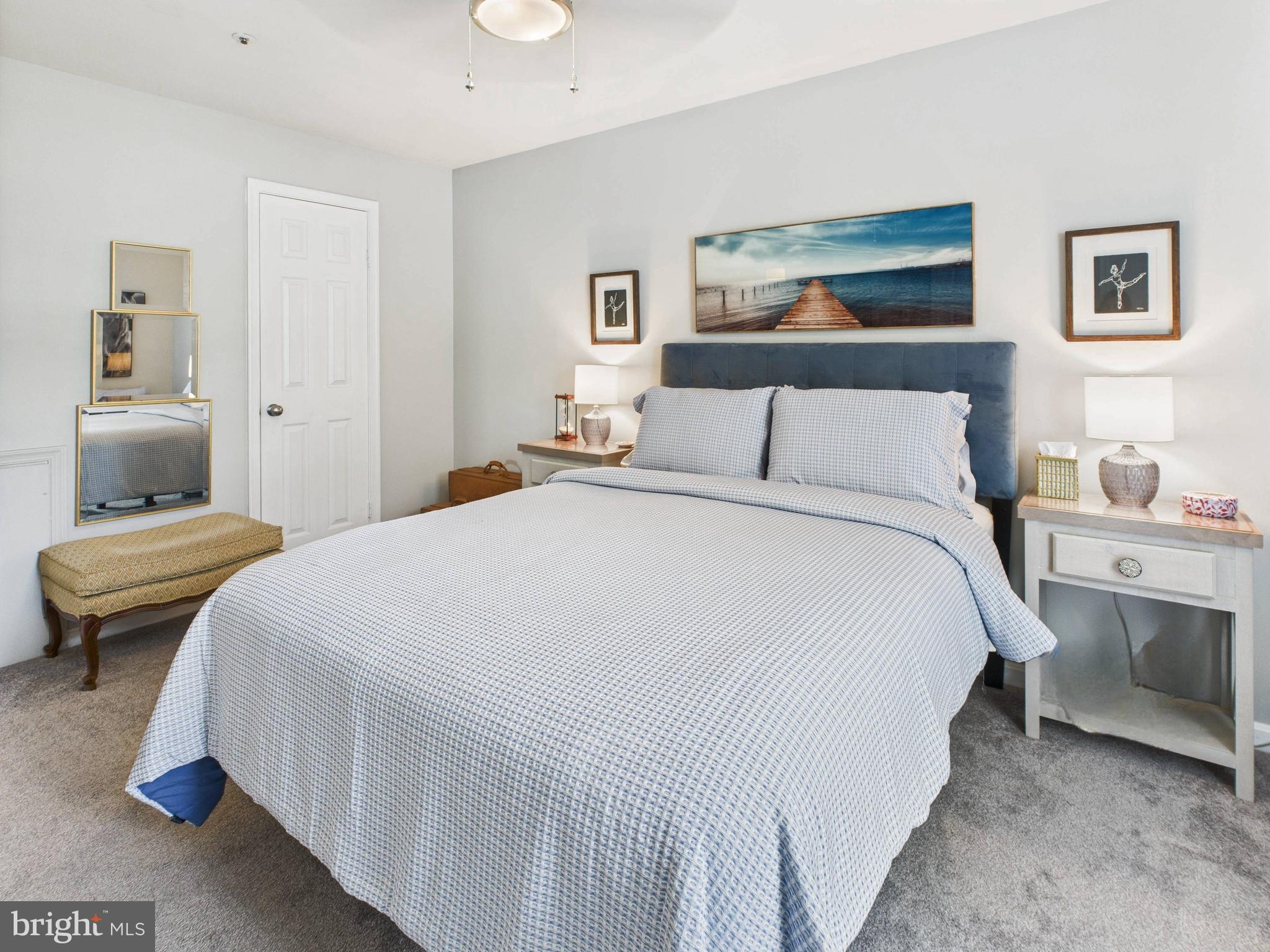 11269 Raging Brook Drive, Unit 258 Bowie, MD 20720 - Photo 28 of 36 a bedroom with a bed and window