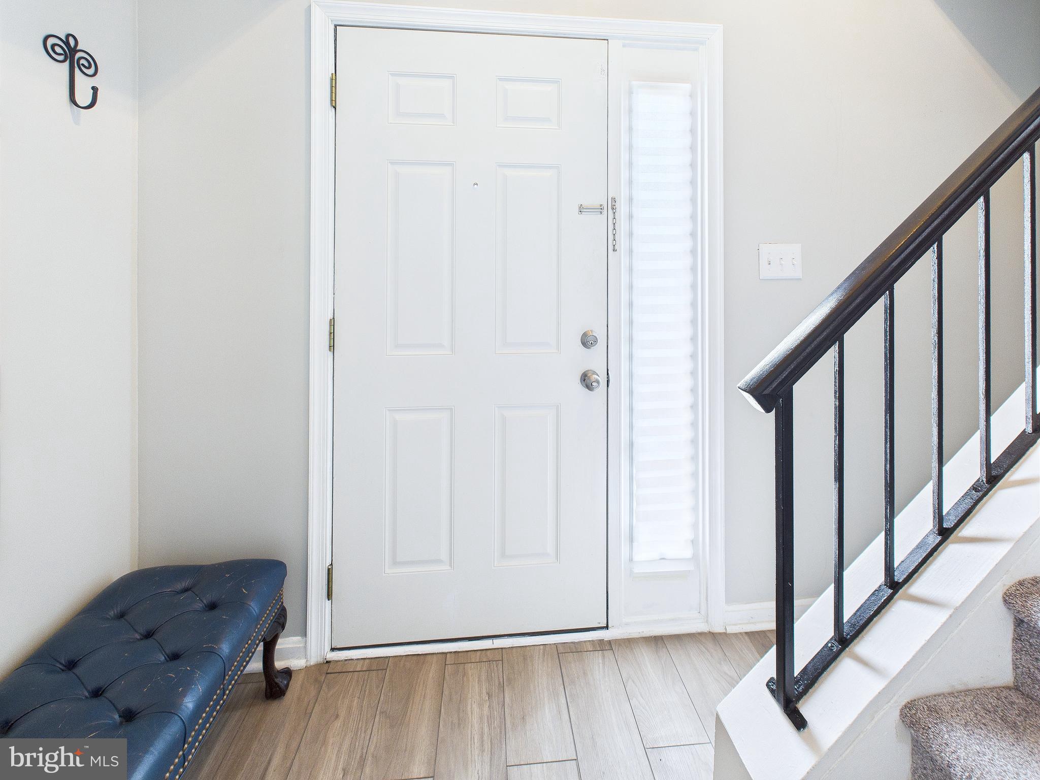 11269 Raging Brook Drive, Unit 258 Bowie, MD 20720 - Photo 5 of 36 a view of livingroom with furniture and wooden floor