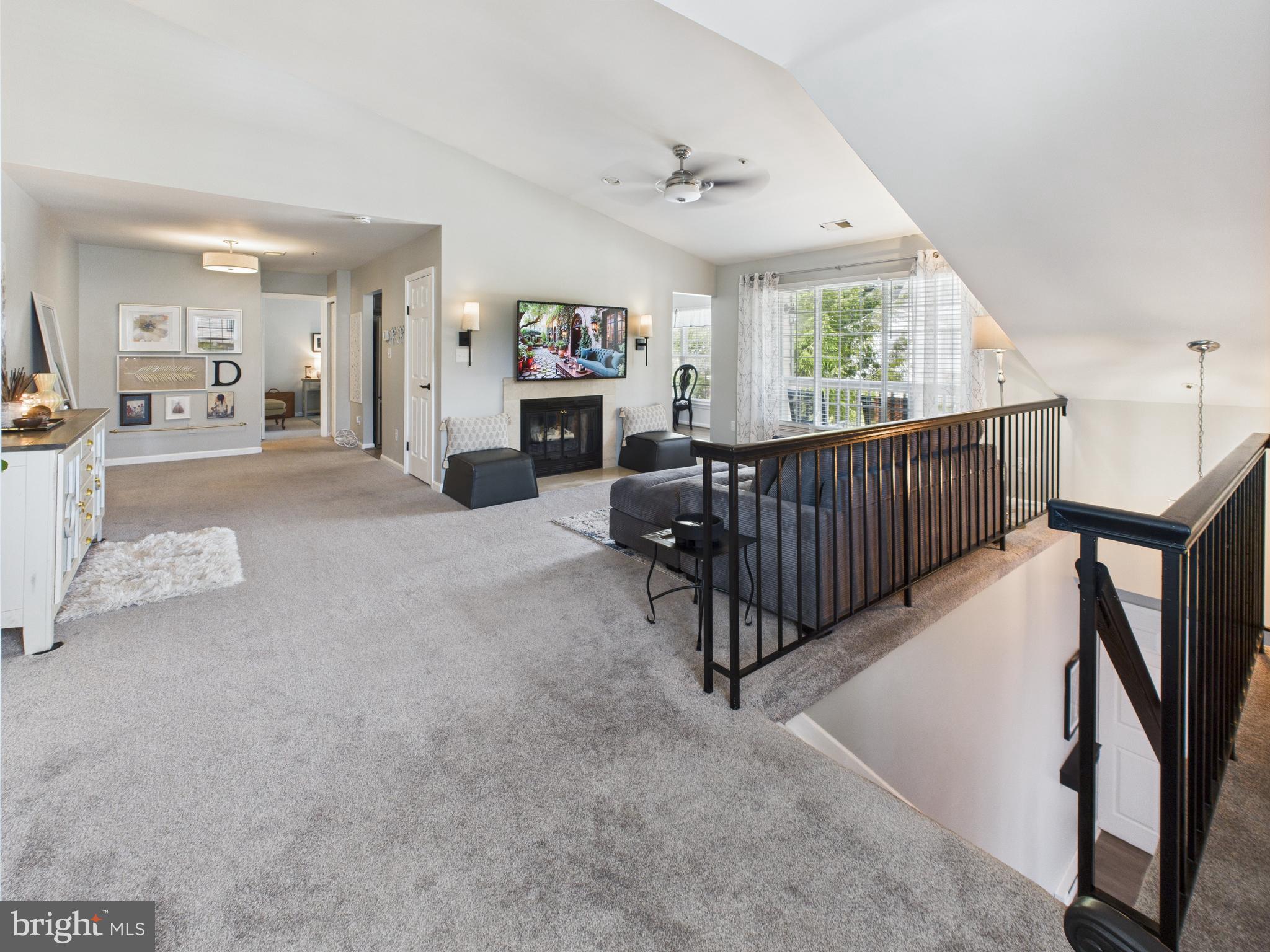 11269 Raging Brook Drive, Unit 258 Bowie, MD 20720 - Photo 9 of 36 a view of an empty room with windows